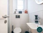 Modern wohnen mit Komfort: Hochwertige Eigentumswohnung mit Balkon und Aufzug in Heiligenhafen - Gäste WC